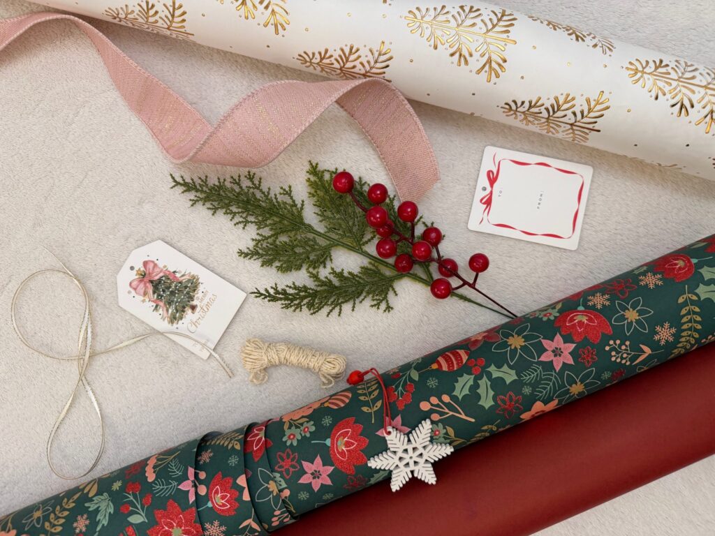 Holiday gift wrap with wired and satin ribbons and festive seasonal tags