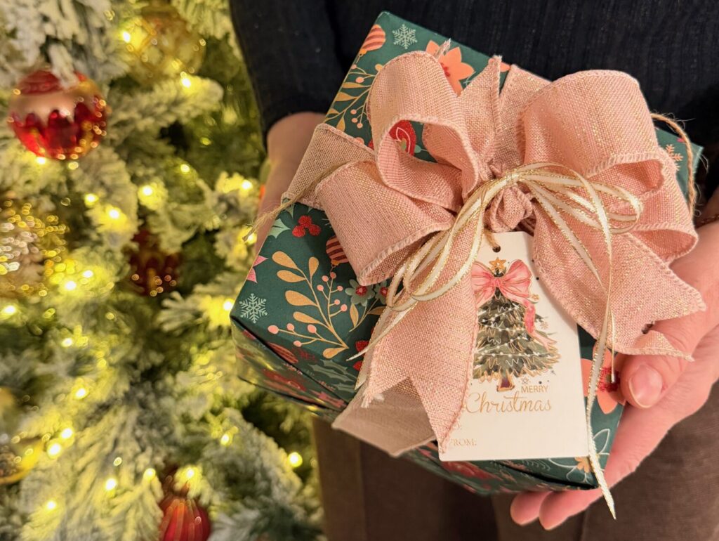 Premium ribbon and gift tag detail on professionally wrapped present